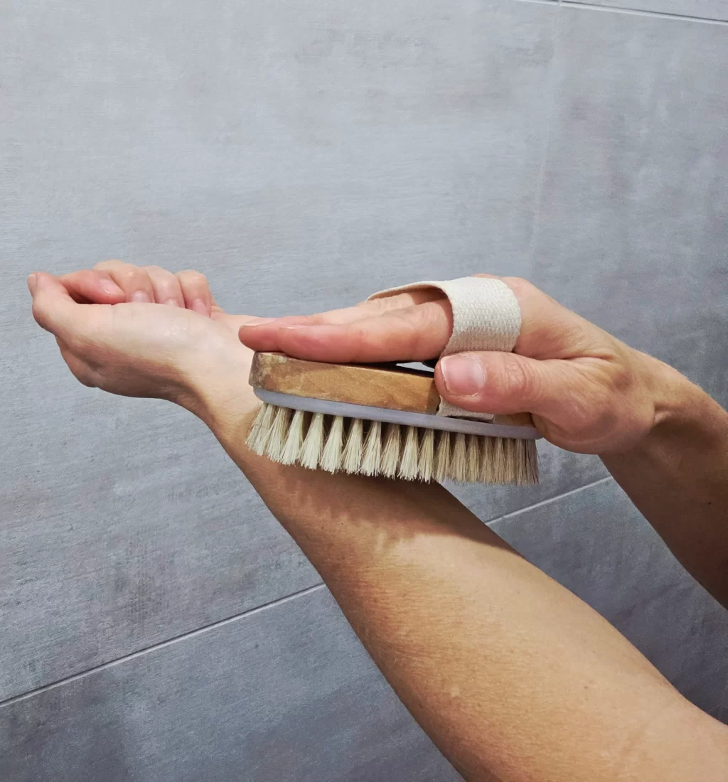 light skinned arm using a dry brush in soft gentle strokes